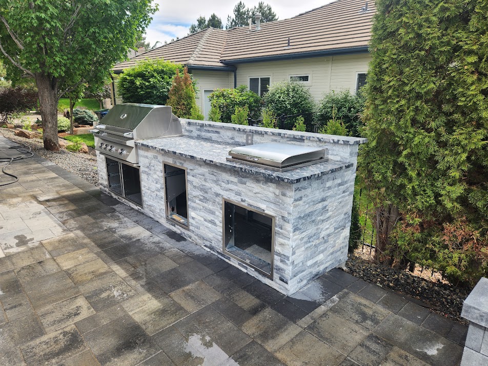 Outdoor kitchen and BBQ stone tile island