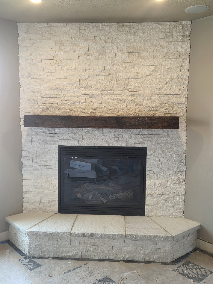 Custom stacked stone fireplace surround