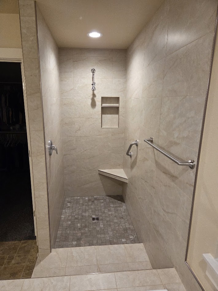 Walk-in steam shower with tile bench